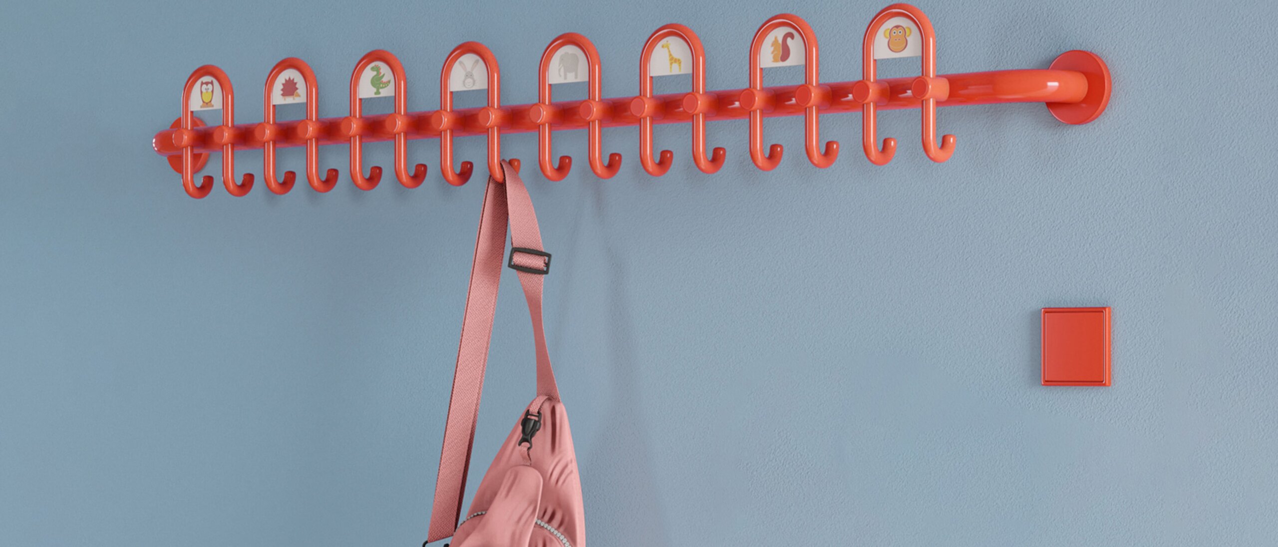 Colourful kindergarten equipped with fittings and wardrobe in the colour orange