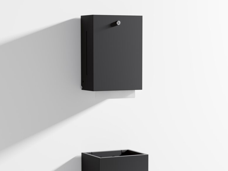 Paper towel dispenser and waste garbage can with angular design in matt black stainless steel